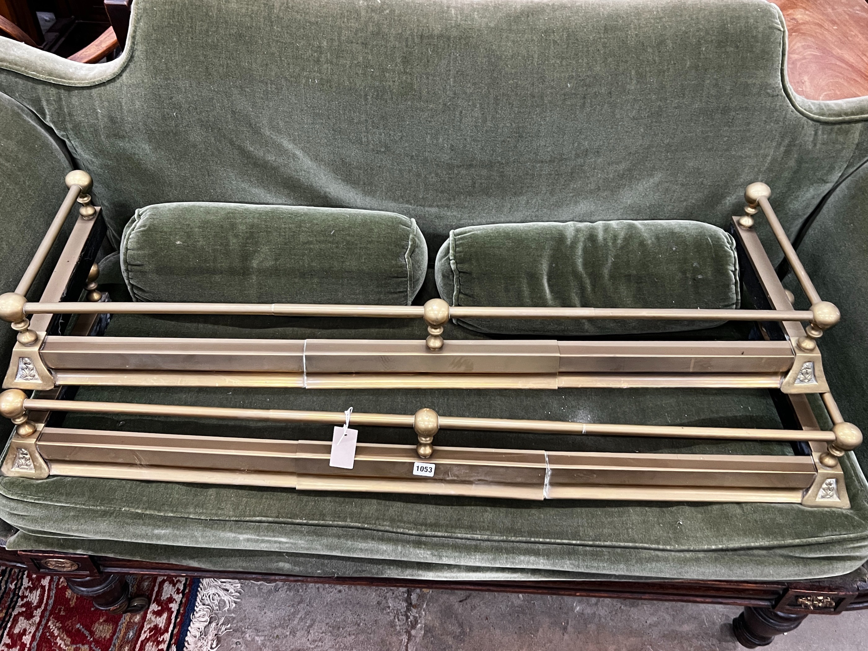 A pair of Victorian style telescopic brass fenders